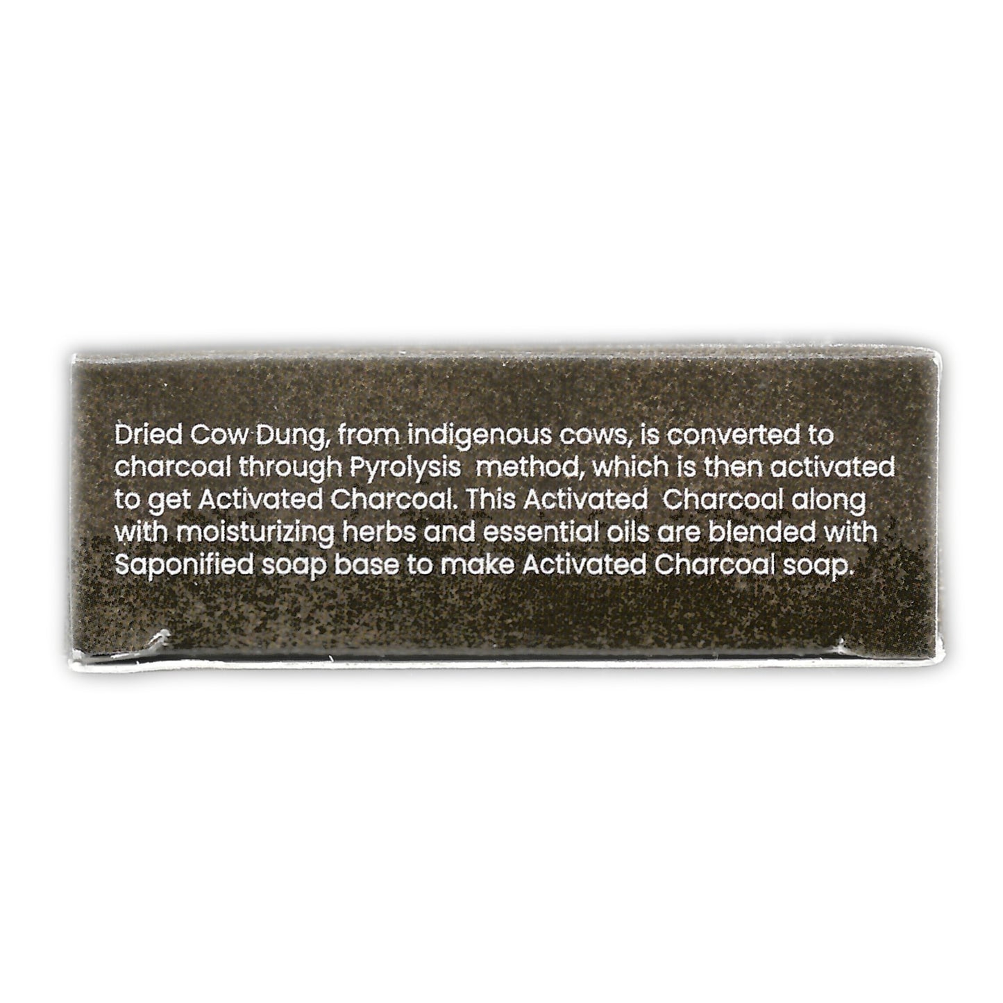 Dark-toned label featuring the soap-making process for Cowpathy Cow Dung Charcoal Soap. Describes how dried cow dung from Indigenous cows undergoes pyrolysis to become activated charcoal, which is then blended with herbs, essential oils, and a saponified soap base. Text emphasizes purity, tradition, and detox benefits.