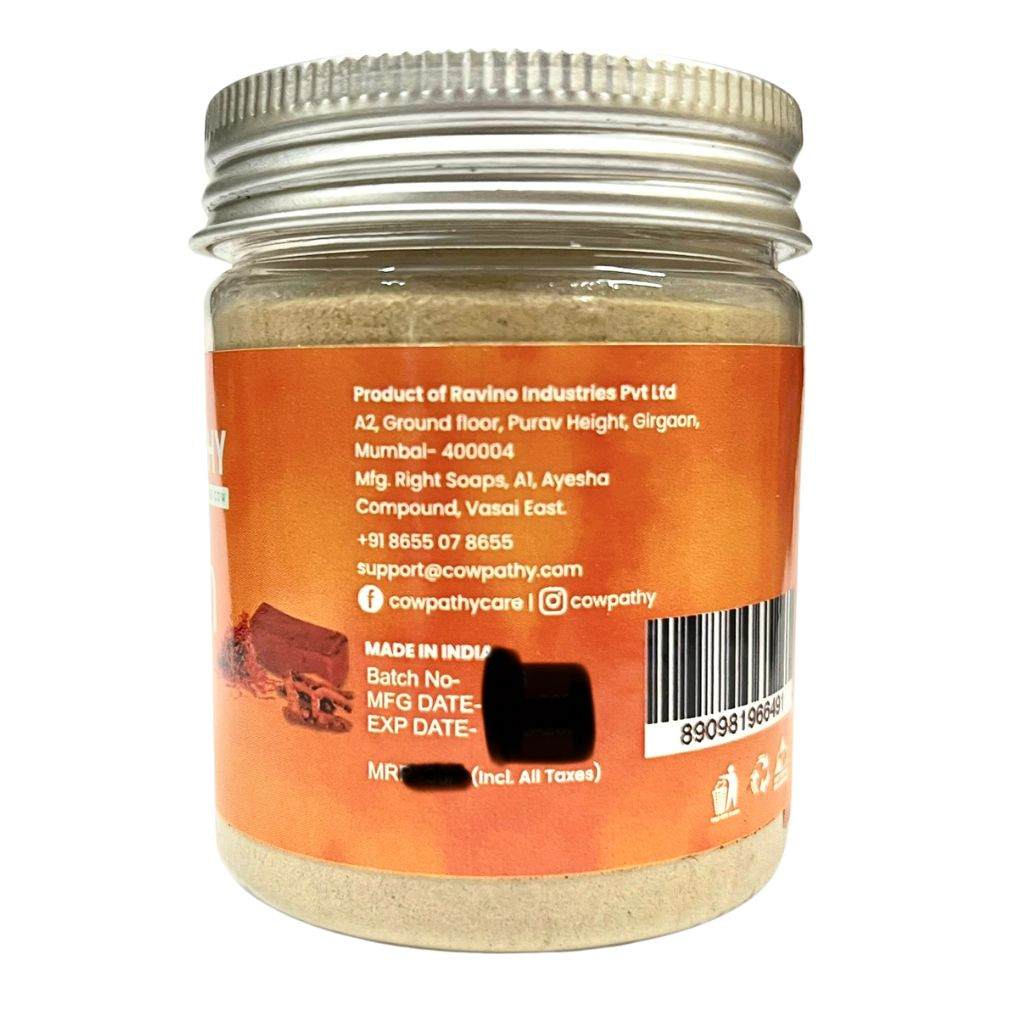 Cowpathy Ubtan Face Pack jar with orange label and metallic lid—Ayurvedic herbal powder featuring skin-purifying ingredients like Amba Haldi, Neem, and Orange Peel.