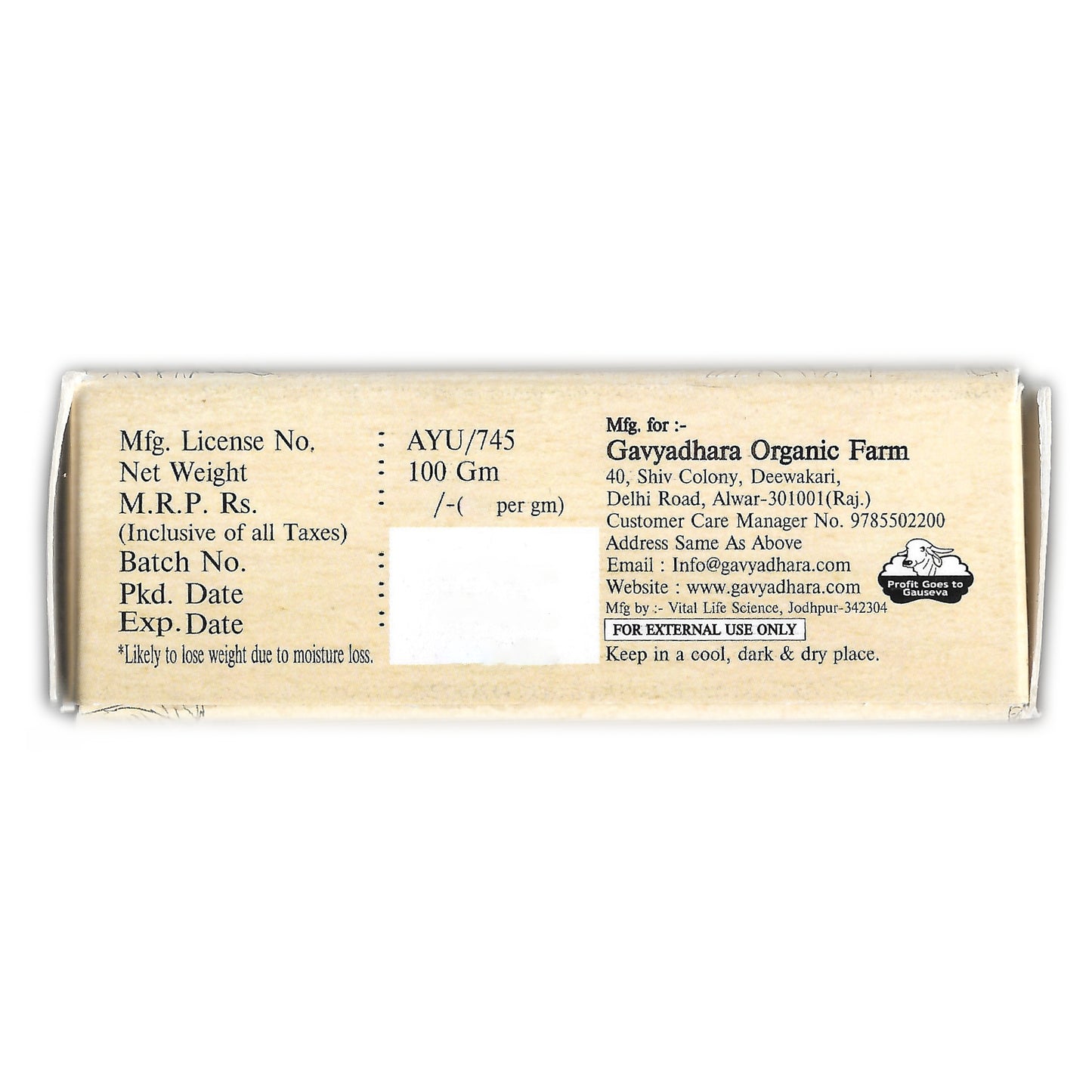 Side panel of Gavyadhara Glycerin Neem Soap packaging from Gavyadhara Organic Farm. Displays manufacturer license number, net weight (100gm), batch details, pricing, and expiration info. Includes usage advisory (“For External Use Only”) and contact details—email, phone number, website, and farm address—highlighting transparency and Ayurvedic credibility.