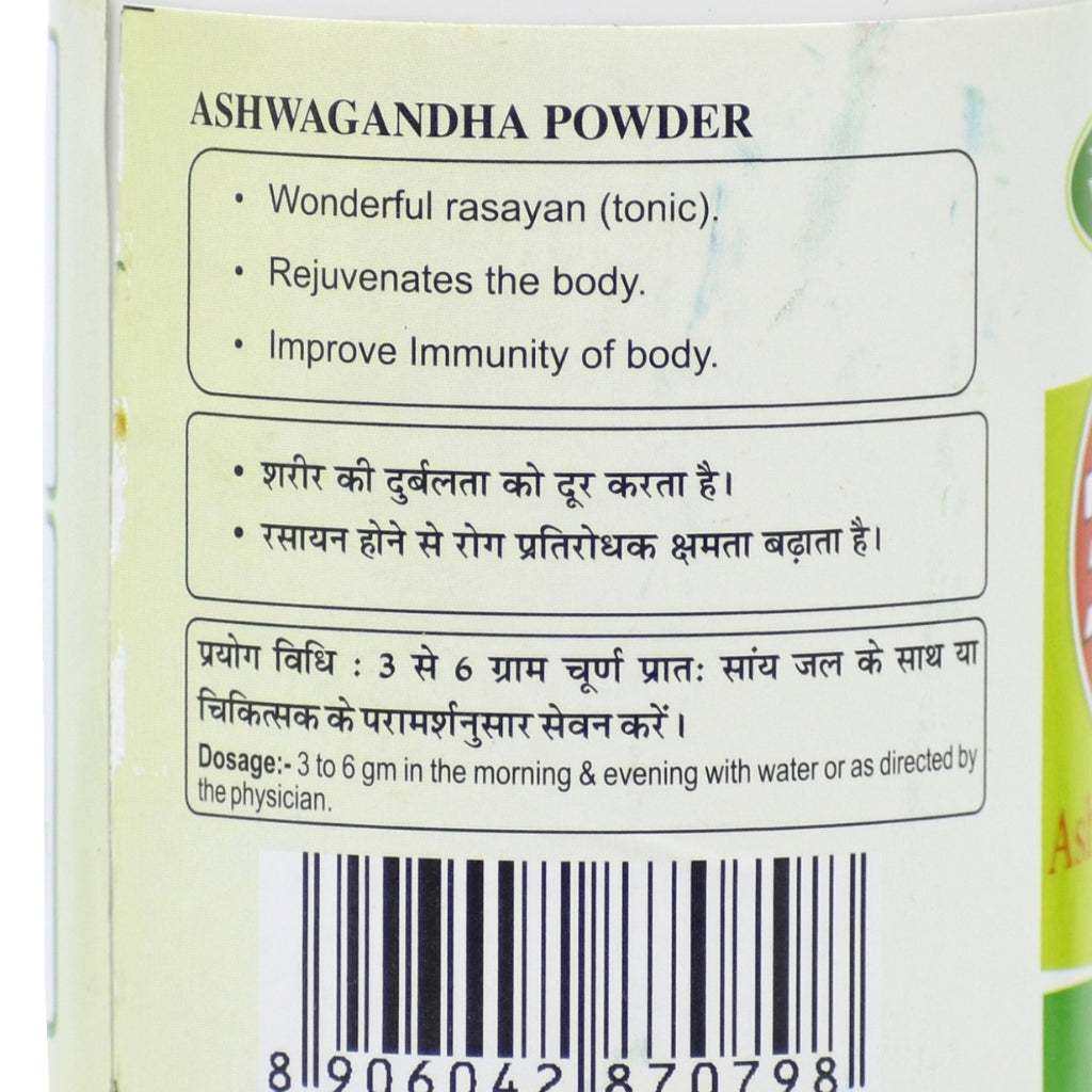 Label of Ashwagandha Powder container featuring bilingual text in Hindi and English. Highlights include benefits such as rejuvenation, immunity support, and rasayan properties. Dosage instructions recommend 3–6 grams in the morning and evening with water or as directed by a physician. Includes a barcode.