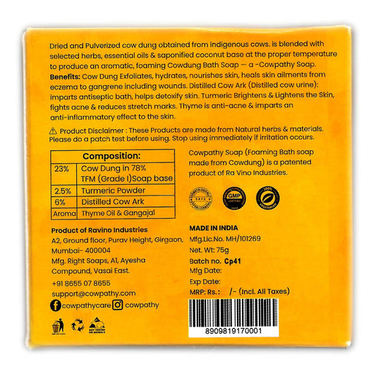 Back of Cowpathy Turmeric & Thyme Antioxidant Bath Soap packaging showing detailed composition, benefits, and manufacturer information. Mentions 23% cow dung, turmeric, thyme oil, distilled cow urine ark, and coconut-based formula. Highlights patented formula, net weight of 75g, and product disclaimer.