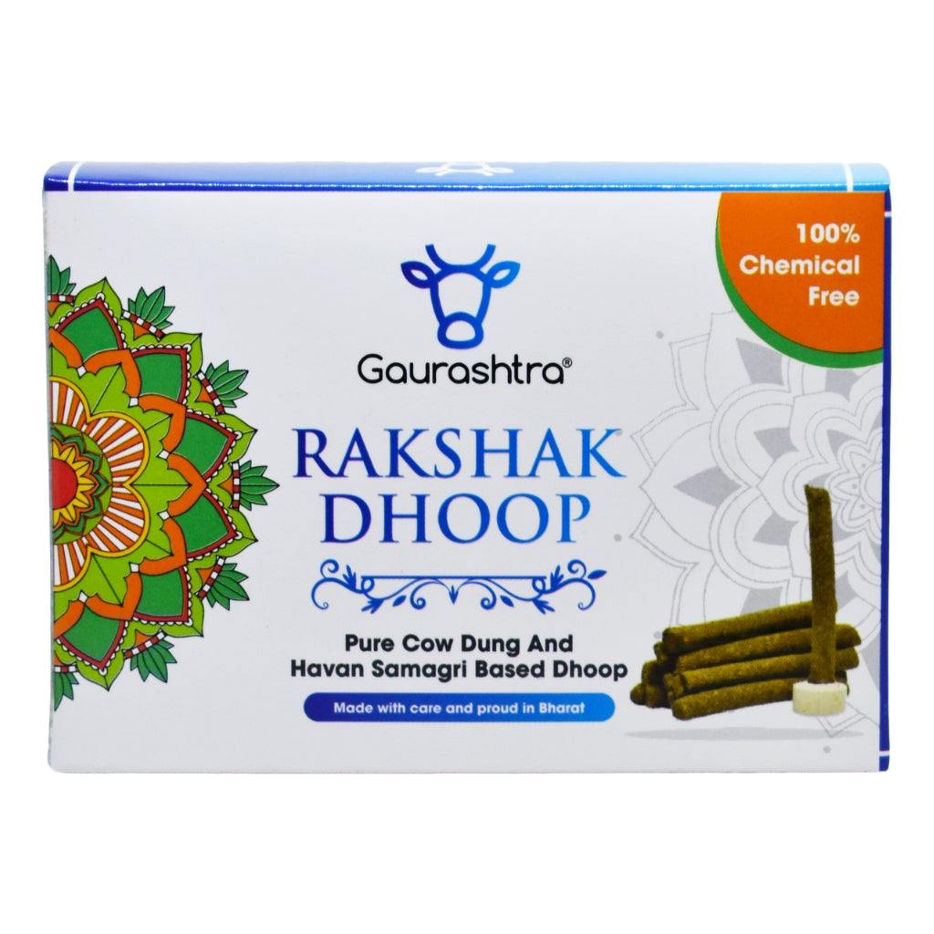 A box of “Rakshak Dhoop” from the brand Gaurashtra is displayed. The packaging emphasizes that the product is made from pure cow dung and havan samagri, and is 100% chemical-free. The label proudly states it is “Made with care and proud in Bharat.” The box features a colorful mandala design on the left and an image of dhoop sticks on the right.