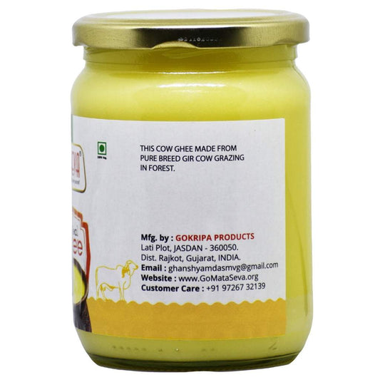 Clear glass jar of Gokripa Cow Ghee with gold screw-lid—label reads “Cow ghee made from pure breed Gir cows grazing in forest,” features Gokripa Products branding and vegetarian symbol.