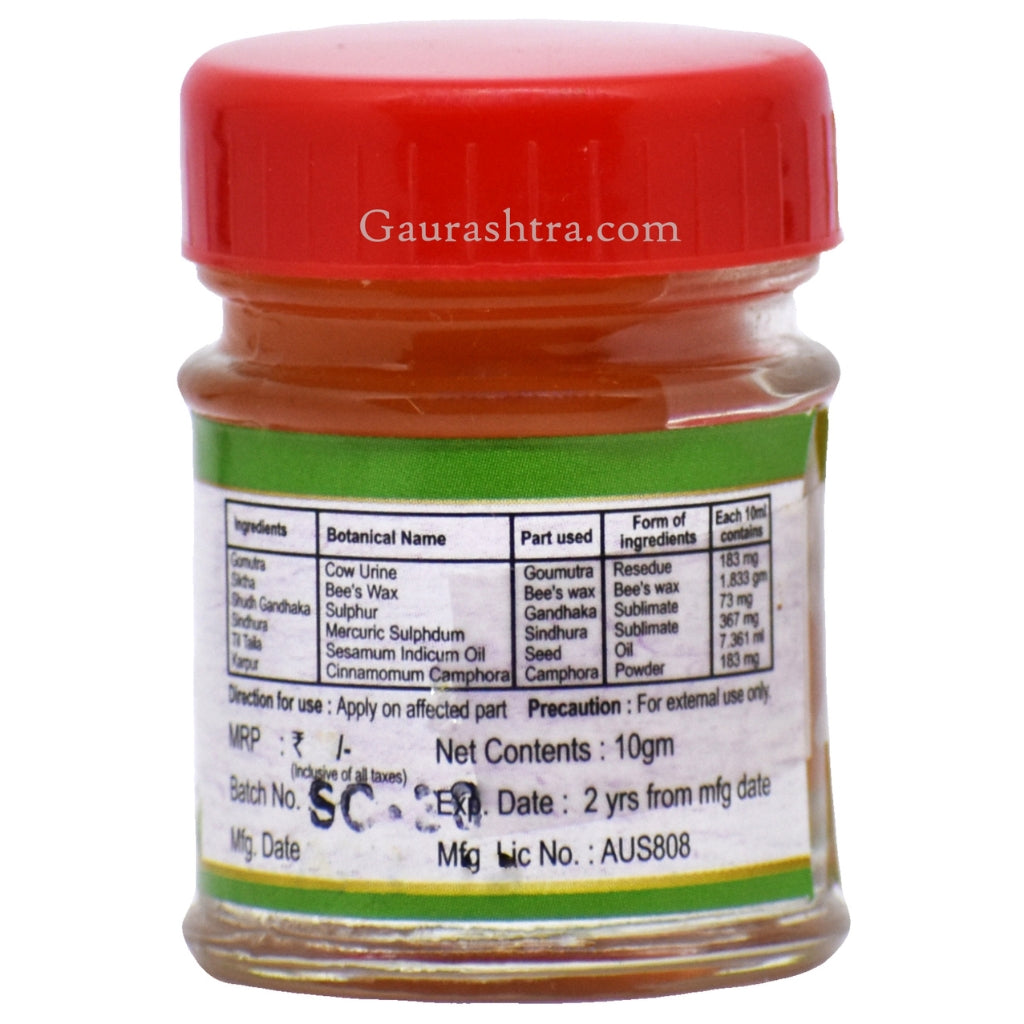Back panel of Sucharana Panchagavya Foot Cream jar displaying full ingredient composition per 10 ml. Includes Goumutra residue, beeswax, Shudh Gandhak (sublimated sulphur), Sindhura (Mercuric Sulphide), Til Oil (Sesame seed oil), and Kapur (Camphor). Label notes “Apply on affected part” and “For external use only.” Manufacturing details such as license number, batch info, and expiry date are partially visible.